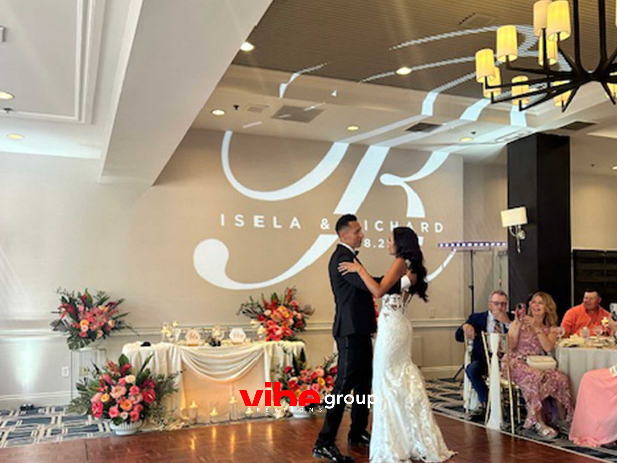 Monogram projection on the dance floor at Isela and Richard's reception